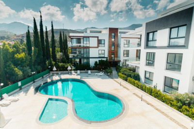 GİRNE/ALSANCAK'TA ORTAK HAVUZLU SİTE İÇERİSİNDE SATILIK 2+1 FUL EŞYALI DAİRE