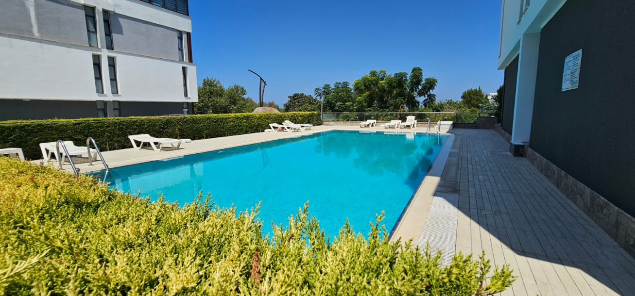 GİRNE/LAPTA'DA HAVUZLU SİTE İÇERİSİNDE SATILIK 2+1 BAHÇELİ DAİRE-2